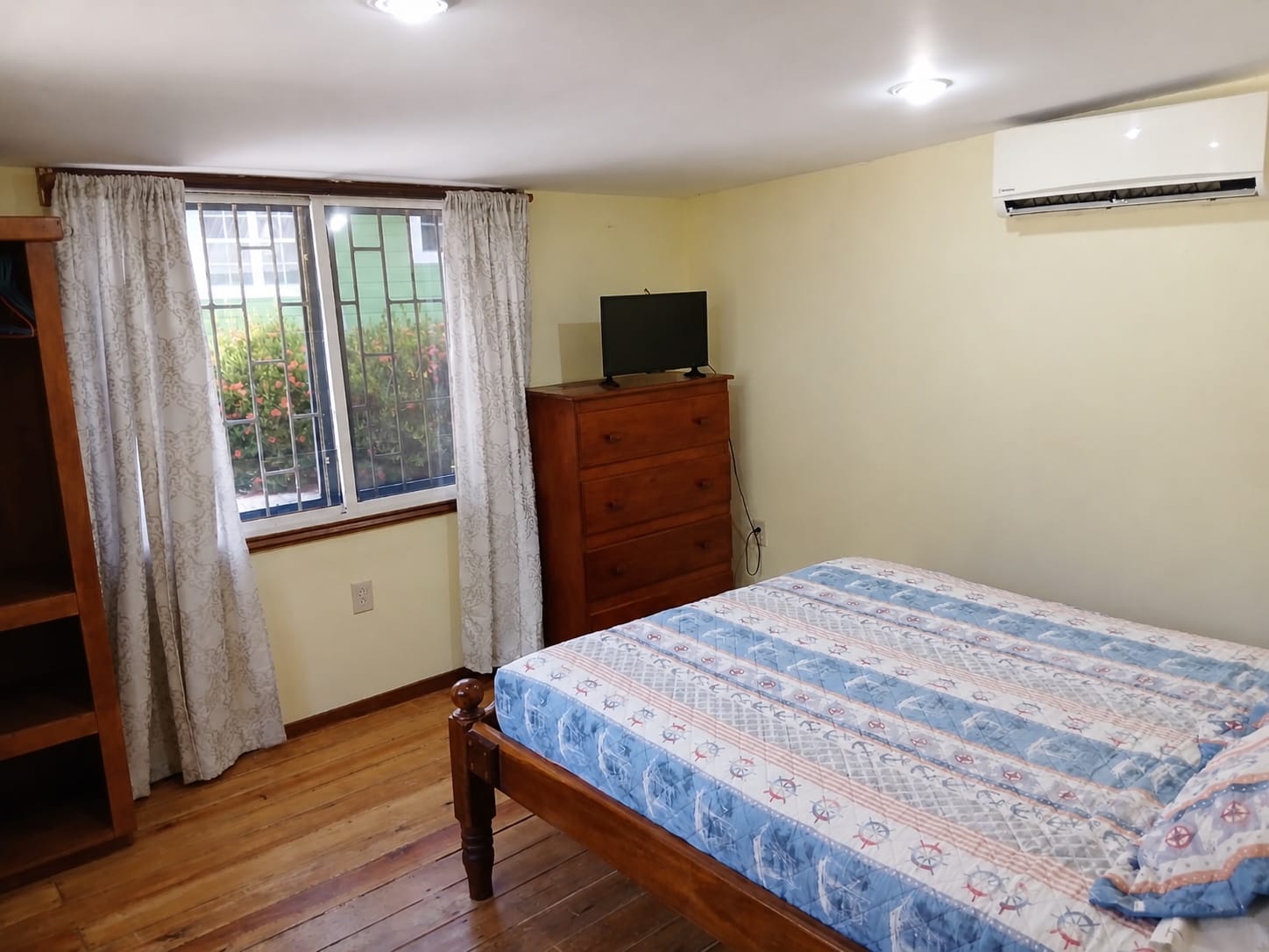 Cabana Cruz bedroom with television and storage