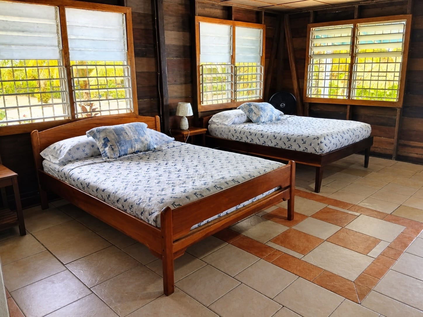 Cabana Playa interior with two queen beds and louvred windows
